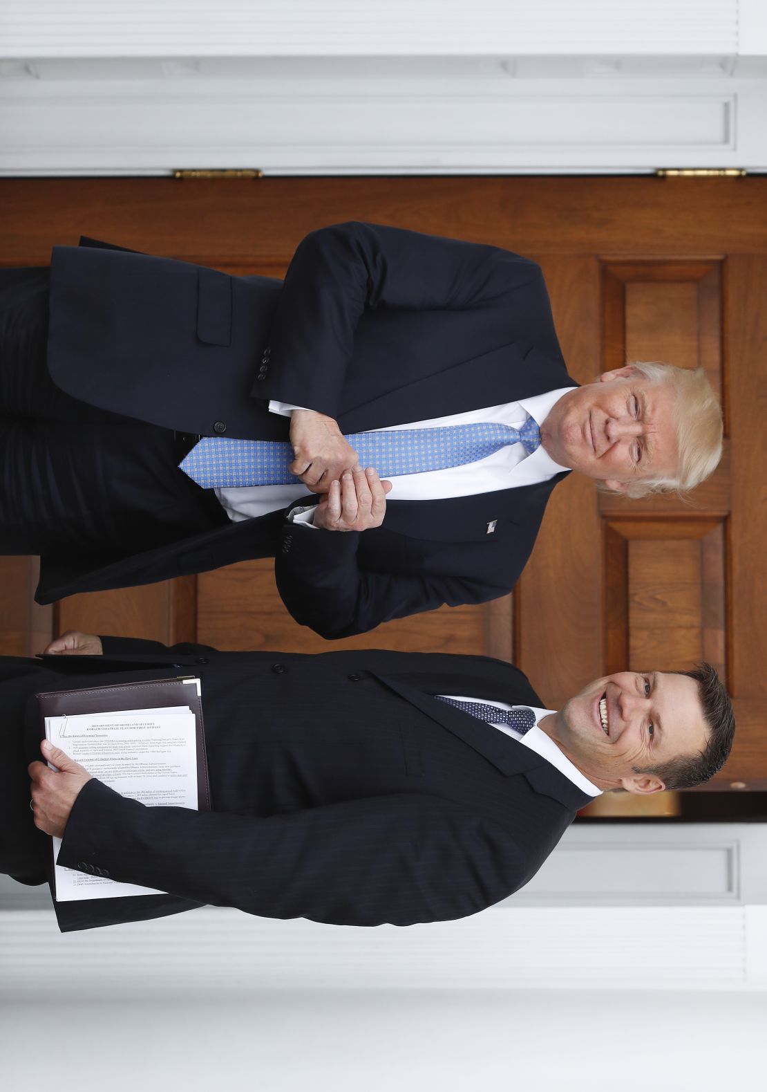 The document Kansas secretary of state Kris Kobach is holding during a photo-op with President-elect Donald Trump on Sunday in Bedminster, NJ. (AP Photo/Carolyn Kaster)