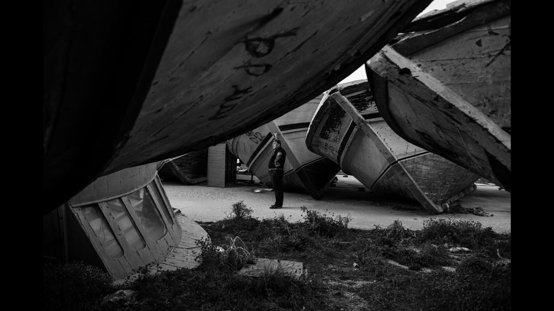 Bartolo stands among a "boat cemetery" in Lampedusa. "Even before the politics and thinking whether it is right or not if these migrants come to Italy, you should see with your own eyes the inhuman conditions in which they arrive," Bartolo told Schirato.