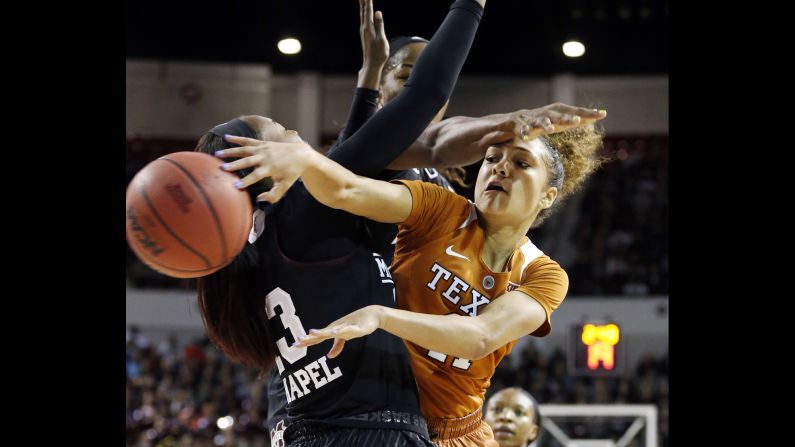 Texas guard Brooke McCarty passes around Mississippi State forward Ketara Chapel during a college basketball game in Starkville, Mississippi, on Sunday, November 20.