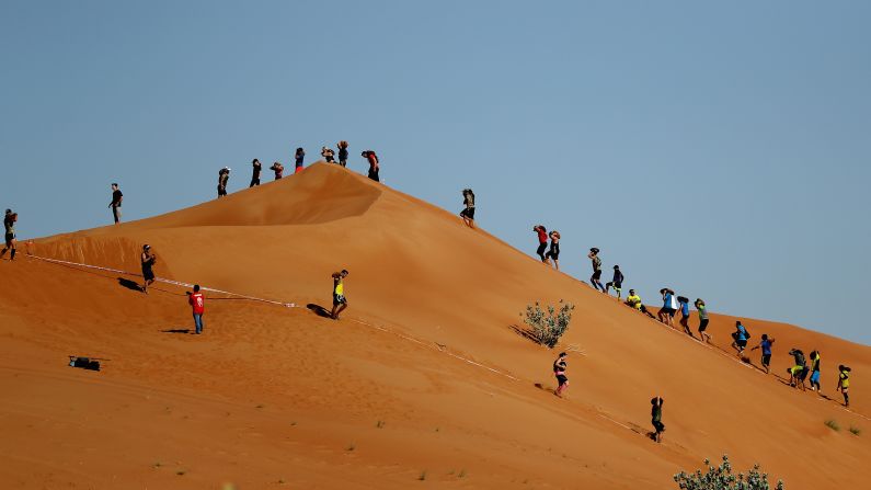 Competitors make their way across Emirati dunes during the Dubai Spartan Race on Friday, November 18.
