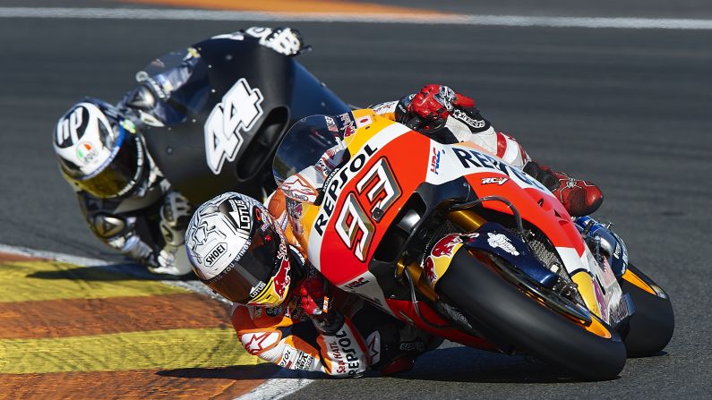 Marc Marquez, right, rounds a corner during MotoGP testing in Valencia, Spain, on Tuesday, November 15. Marquez recently won his third championship on the circuit.
