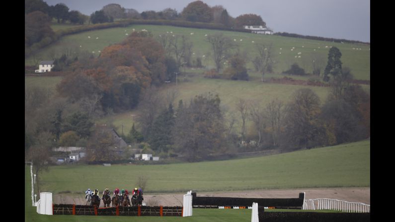 Horses compete in a hurdle race in Chepstow, Wales, on Wednesday, November 16.