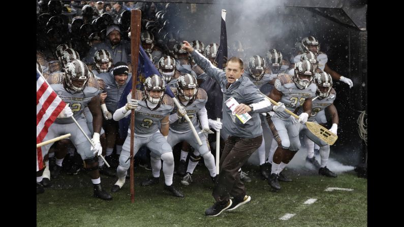Western Michigan head coach P.J. Fleck leads his team onto the field before their home game against Buffalo on Saturday, November 19. The Broncos won 38-0 to improve their record to 11-0. Alabama is the only other undefeated team in college football's top division.