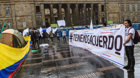 Colombians demonstrate with white flags, calling for a peace deal, in Bogota last Friday.