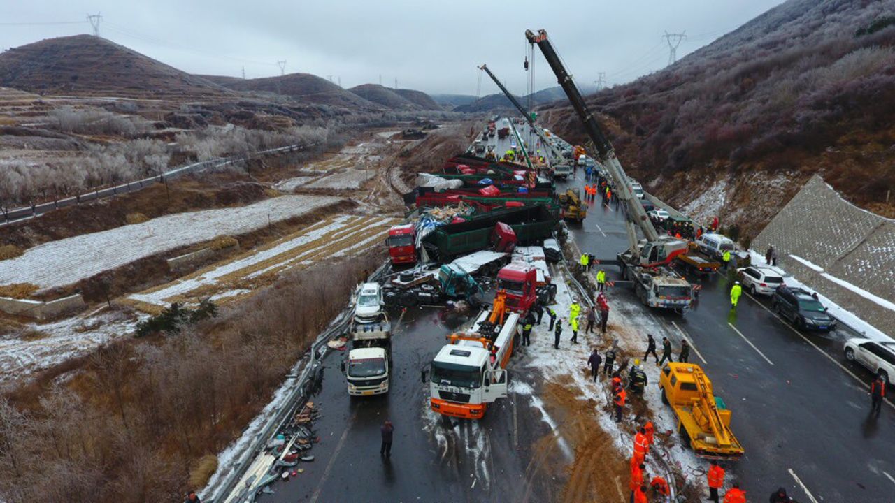 The road was blocked as rescuers worked to free those trapped.