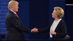 US Democratic presidential candidate Hillary Clinton (R) and US Republican presidential candidate Donald Trump shake hands at the end of the second presidential debate at Washington University in St. Louis, Missouri, on October 9, 2016. / AFP / Robyn Beck        (Photo credit should read ROBYN BECK/AFP/Getty Images)