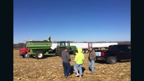 Neighbors complete the harvest of more than 100 acres on Wollyung's farm in seven hours.