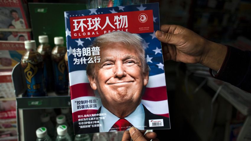 TOPSHOT - A copy of the local Chinese magazine Global People with a cover story that translates to "Why did Trump win" is seen with a front cover portrait of US president-elect Donald Trump at a news stand in Shanghai on November 14, 2016.  
Chinese President Xi Jinping and US president-elect Donald Trump agreed November 14 to meet "at an early date" to discuss the relationship between their two powers, Chinese state broadcaster CCTV said.  / AFP / JOHANNES EISELE        (Photo credit should read JOHANNES EISELE/AFP/Getty Images)