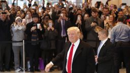 President-elect Donald Trump walks past a crowd as he leaves the New York Times building following a meeting, Tuesday, Nov. 22, 2016, in New York. (AP Photo/Mark Lennihan)