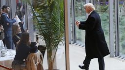 President-elect Donald Trump gestures to people seated in a restaurant as he leaves the New York Times building following a meeting, Tuesday, Nov. 22, 2016, in New York. (AP Photo/Mark Lennihan)
