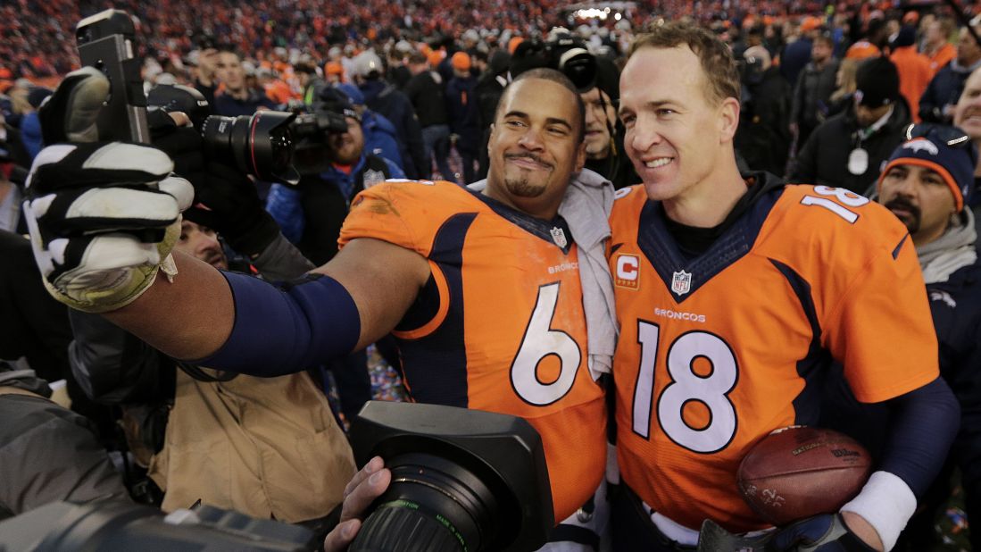 Denver Broncos offensive lineman Ryan Harris takes a selfie with quarterback Peyton Manning after the Broncos won the AFC Championship on Sunday, January 24. The Broncos went on to win the Super Bowl, and then Manning retired.