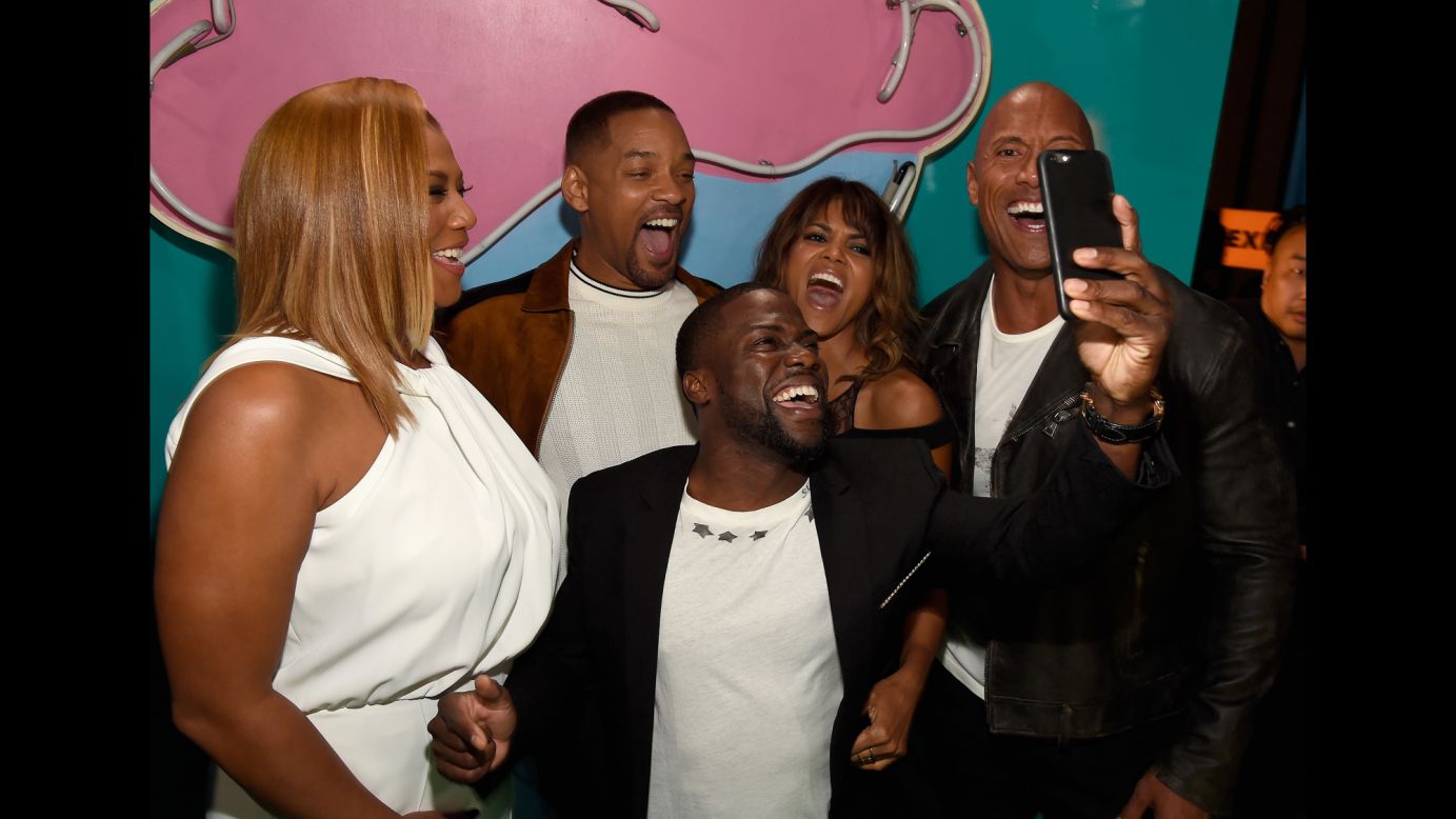 Comedian Kevin Hart takes a selfie with, from left, actors Queen Latifah, Will Smith, Halle Berry and Dwayne Johnson on Saturday, April 9. Hart and Johnson were hosting the MTV Movie Awards.