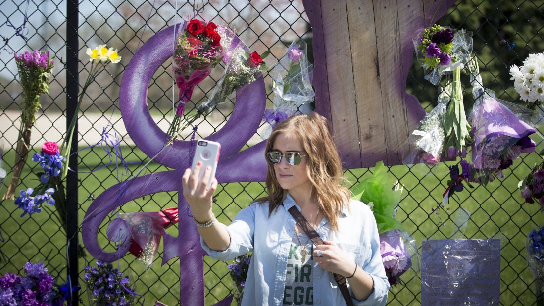 A woman takes a selfie in front of a Prince memorial in Chanhassen, Minnesota, on Friday, April 22. The iconic musician <a href="http://www.cnn.com/2016/04/21/entertainment/gallery/prince-rogers-nelson/index.html" target="_blank">died a day earlier</a> at the age of 57.