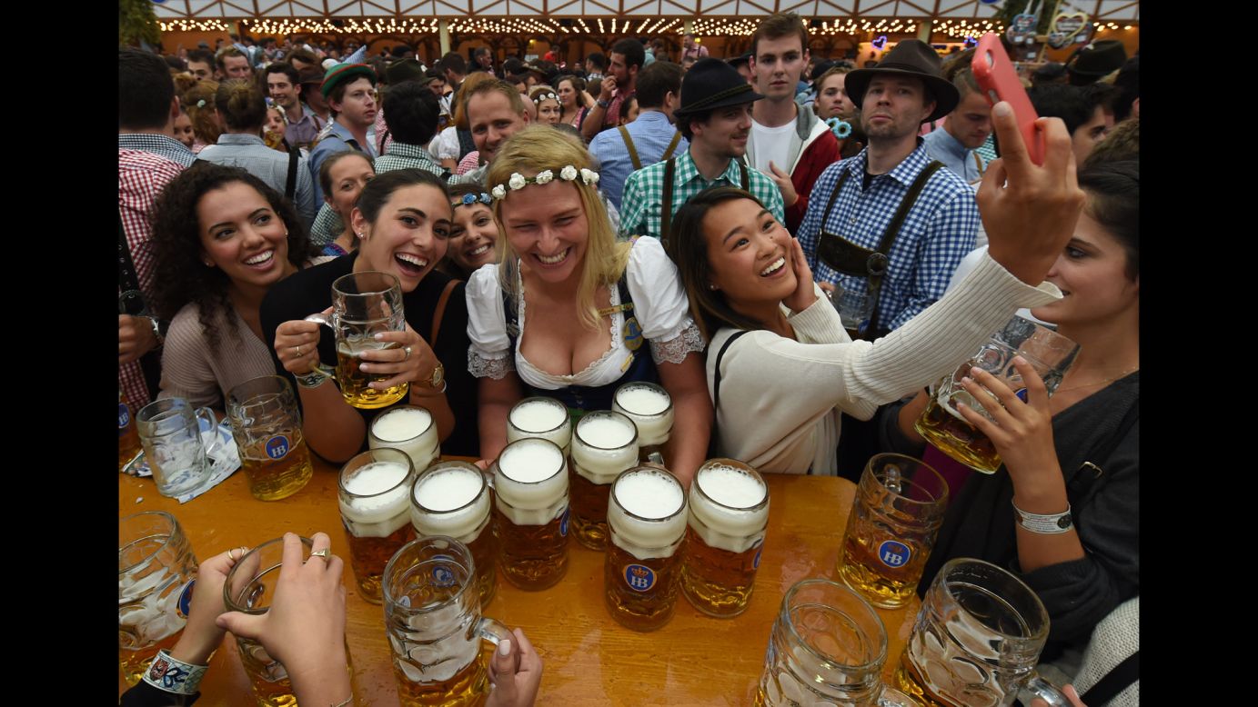Visitors enjoy the Oktoberfest beer festival in Munich, Germany, on Saturday, September 17.