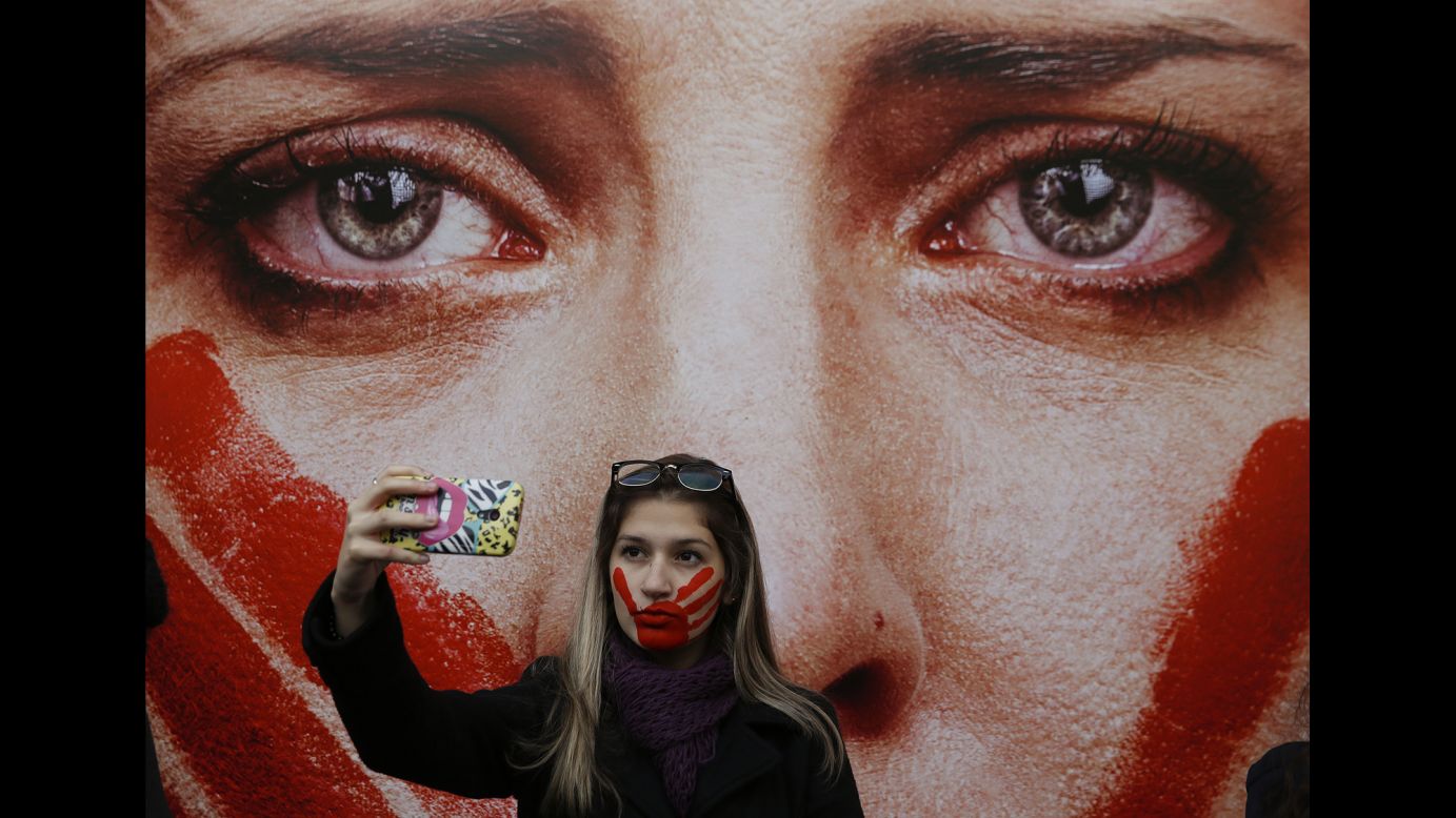 An activist in Sao Paulo, Brazil, takes a selfie Friday, June 10, during a protest against rape and violence against women. The protest came weeks after <a href="http://www.cnn.com/2016/05/30/americas/brazil-gang-rape-victim-speaks/" target="_blank">a 16-year-old girl was reportedly gang-raped</a> in Rio de Janeiro.