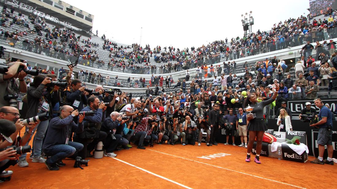 Tennis star Serena Williams takes a photo with her trophy after winning the Italian Open in Rome on Sunday, May 15.