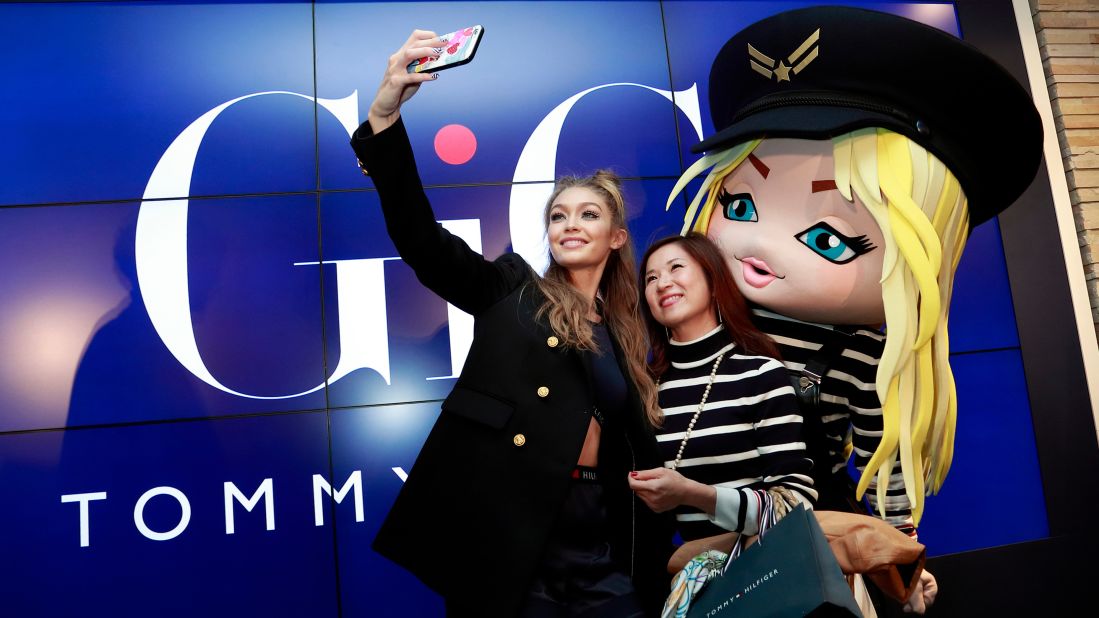 Model Gigi Hadid takes a selfie with a fan in Tokyo during the launch of her Tommy Hilfiger collaboration on Wednesday, October 12. 