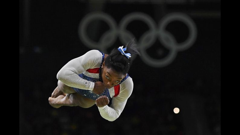 US gymnast Simone Biles competes on the vault after <a href="index.php?page=&url=http%3A%2F%2Fwww.cnn.com%2F2016%2F08%2F11%2Fsport%2Fsimone-biles-usa-gymnastics-rio%2Findex.html" target="_blank">winning Olympic gold in the individual all-around</a> on Thursday, August 11. Biles also won team gold earlier in the week.