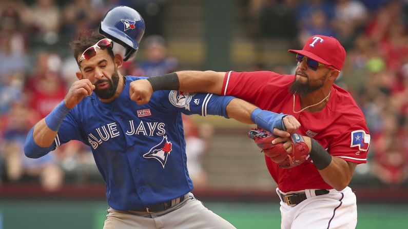 Texas second baseman Rougned Odor, right, punches Toronto outfielder Jose Bautista during a Major League Baseball game in Arlington, Texas, on Sunday, May 15. The confrontation, <a href="index.php?page=&url=http%3A%2F%2Fbleacherreport.com%2Farticles%2F2640341-jose-bautista-rougned-odor-and-more-ejected-after-blue-jays-vs-rangers-brawl" target="_blank" target="_blank">which sparked a bench-clearing brawl,</a> came after the base-running Bautista slid hard into second to try to break up a double play. Both players were ejected, as were several others involved in the brawl afterward.