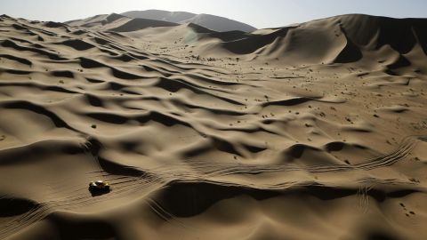 The car of Wein Han and Jean-Pierre Garcin travels through the Gobi Desert of Inner Mongolia as they race in the Silk Way Rally on Friday, July 22. The event started in Moscow and ended in Beijing.