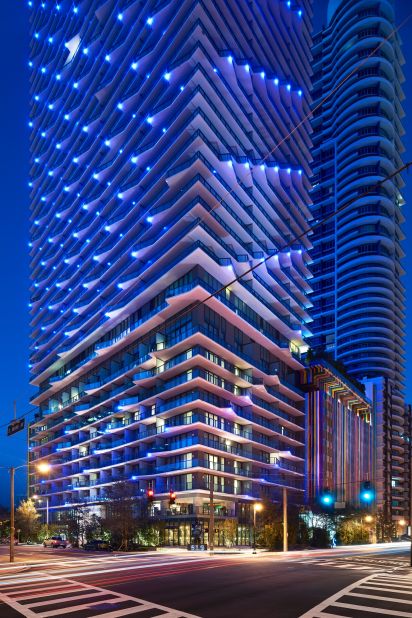 Built by Arquitectonica, one of Miami's most venerable local firms, and sprinkled with contemporary design fairy dust by Philippe Starck, this addition to the Brickell skyline reads from afar like one big Paul Smith shopping bag, with its look-at-me candy-striped facade. 