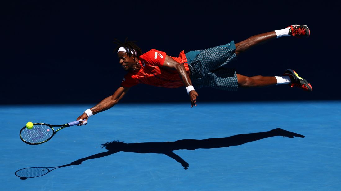 Gael Monfils dives for a forehand during his fourth-round match at the Australian Open on Monday, January 25.