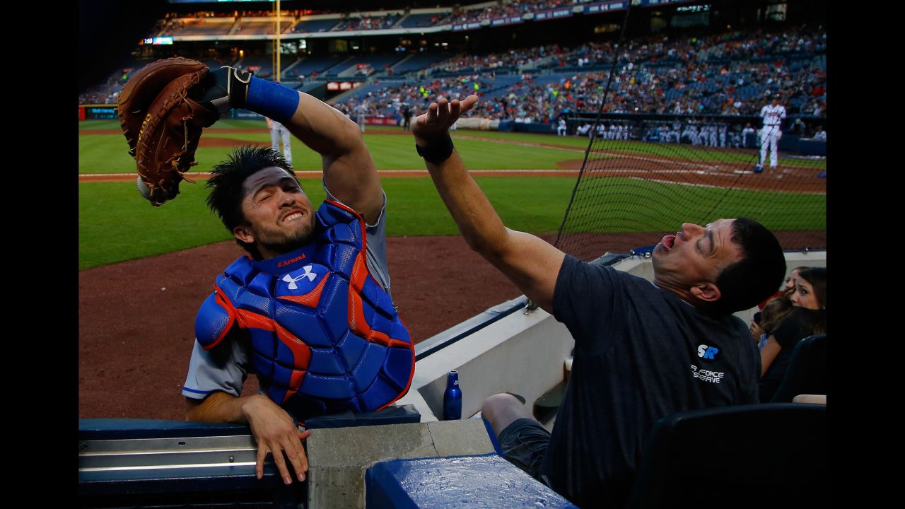 New York Mets catcher Travis d'Arnaud snags a foul ball in Atlanta on Friday, April 22.