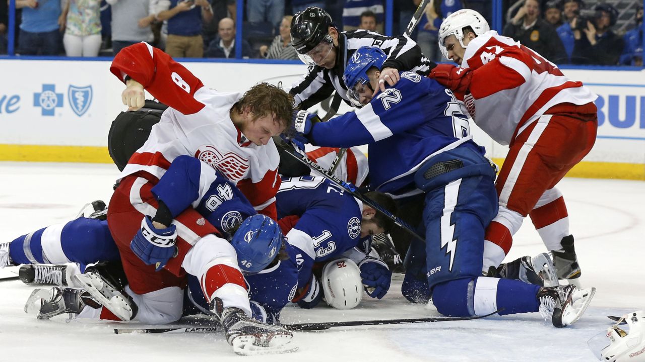 Players from Detroit and Tampa Bay fight during an NHL playoff game on Friday, April 15.