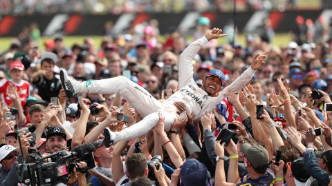 Formula One driver Lewis Hamilton crowd-surfs after his victory at the British Grand Prix on Sunday, July 10. This was his fourth time winning the race.