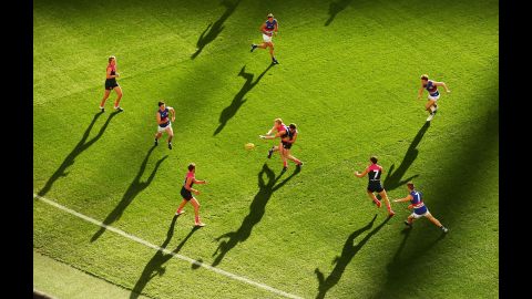 Clayton Oliver of the Melbourne Demons is tackled during an Australian Football League match against the Western Bulldogs on Sunday, May 15.