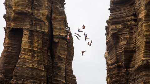 Divers jump off a 72-foot monolith in Portugal's Azores region before a Cliff Diving World Series event on Thursday, July 7.