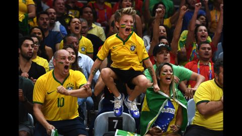 Brazil fans cheer on their women's volleyball team during an Olympic quarterfinal match against China on Wednesday, August 17.