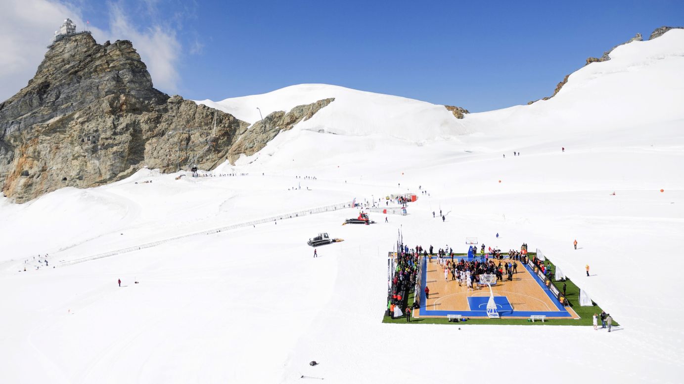 Professional basketball players, including NBA star Tony Parker, play on the Aletsch Glacier in the Swiss Alps on Wednesday, September 14. It was a promotional event for Tissot, one of Parker's sponsors.