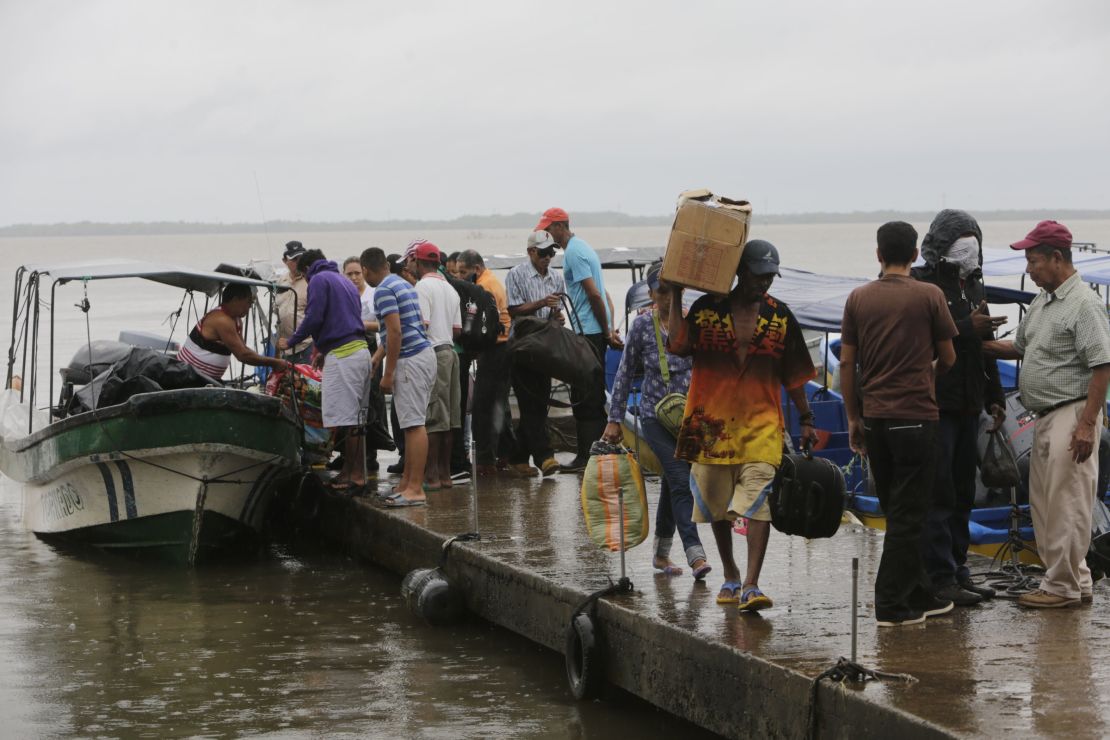 Residents board boats to leave before Hurricane Otto arrives in Bluefields, Nicaragua, on November 23, 2016. 