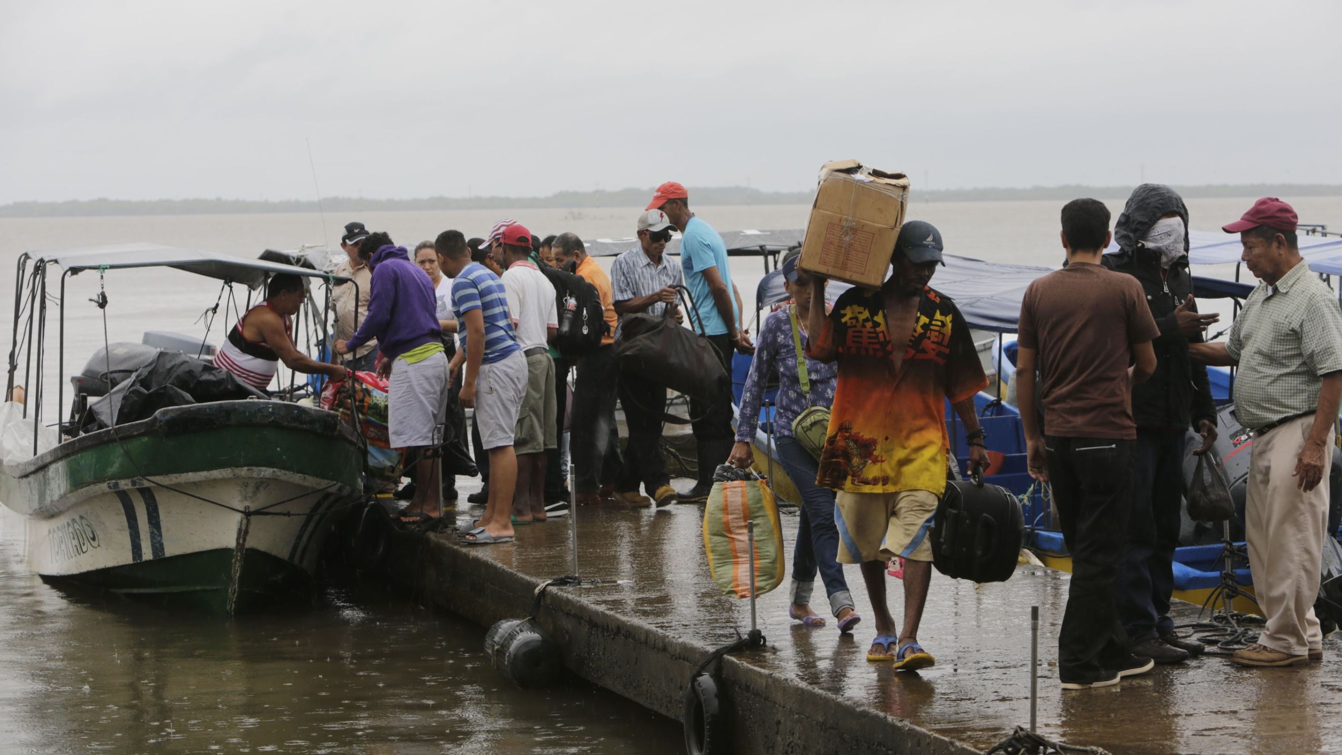 Residents board boats to leave before Hurricane Otto arrives in Bluefields, Nicaragua, on November 23, 2016. 