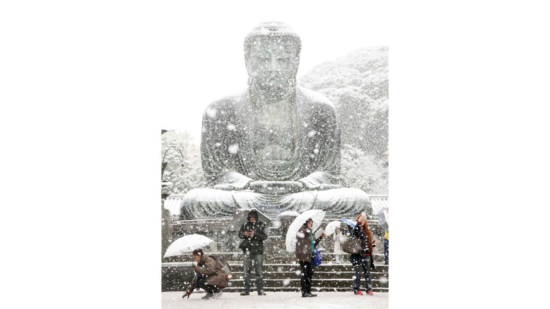 The Great Buddha statue is covered with snow at Kotoku-in temple in Kamakura, near Tokyo.