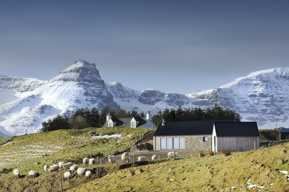 Rural Design created this two-bedroom house on the Isle of Skye's Trotternish peninsula. This modern building is on the site of a ruined Blackhouse. Embracing this history, Rural Design incorporated stone walls into the facade to strengthen this connection with Highland tradition.