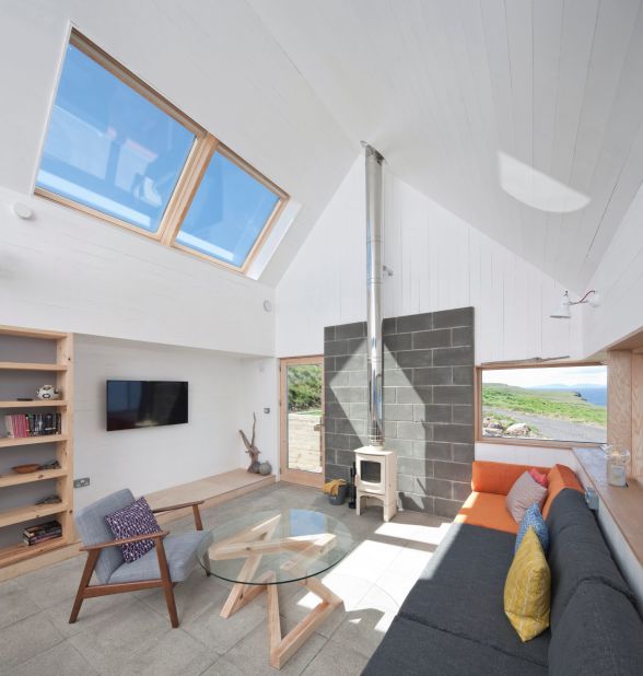 Rural Design do take note of Scotland's unpredictable weather in their designs: "One thing that we can't change: at the end of the day a dwelling here is a shelter from the landscape, from the wild weather," admits Dickson. The interiors are designed to be cosy and welcoming.