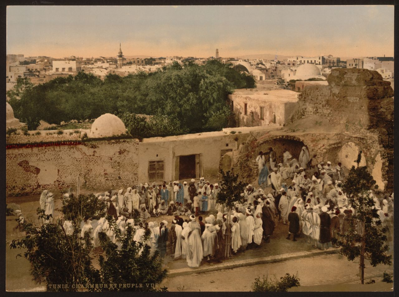 A crowd surrounds a snake charmer in Tunis. Photochroms were created by taking the negative and exposing it to multiple flat surfaces such as stone, glass or zinc. As many as 24 separate slides would we be used, each printing a different color. Together the inks would blend and create realistic hues. (Find out more about the process <a href="http://www.loc.gov/pictures/collection/pgz/process.html" target="_blank" target="_blank">here</a>.)