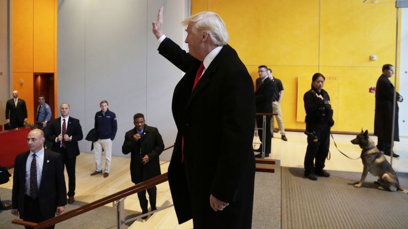 Trump waves to a crowd at The New York Times building after meeting with some of the newspaper's reporters, editors and columnists on Tuesday, November 22. <a href="index.php?page=&url=http%3A%2F%2Fwww.cnn.com%2F2016%2F11%2F22%2Fpolitics%2Ftakeaways-donald-trump-new-york-times-meeting%2F" target="_blank">Six takeaways from the meeting</a>