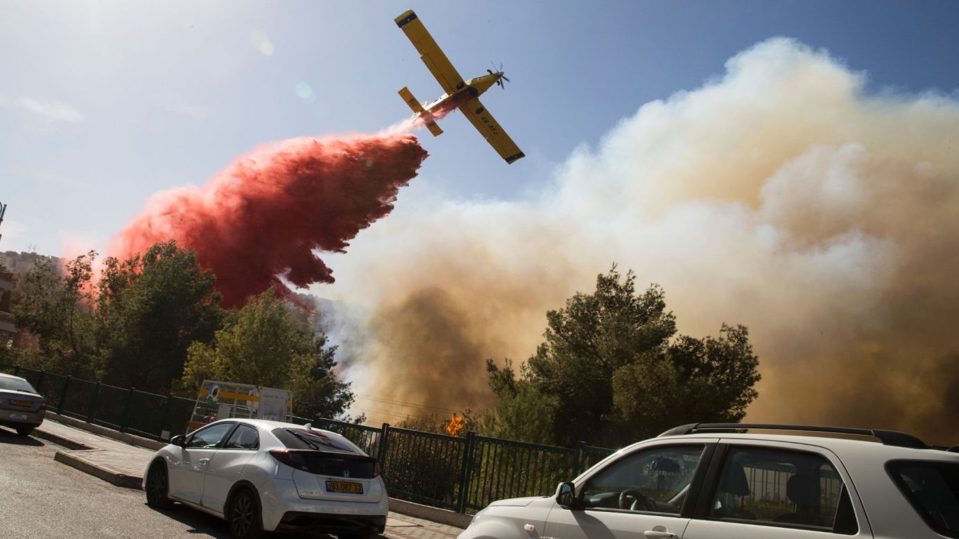 A firefighter plane drops retardant on a wildfire in Haifa, Israel, on Thursday, November 24. Israel is <a href="http://www.cnn.com/2016/11/24/world/israel-wildfires-netanyahu-putin/" target="_blank">battling its most serious wildfires</a> since 2010.