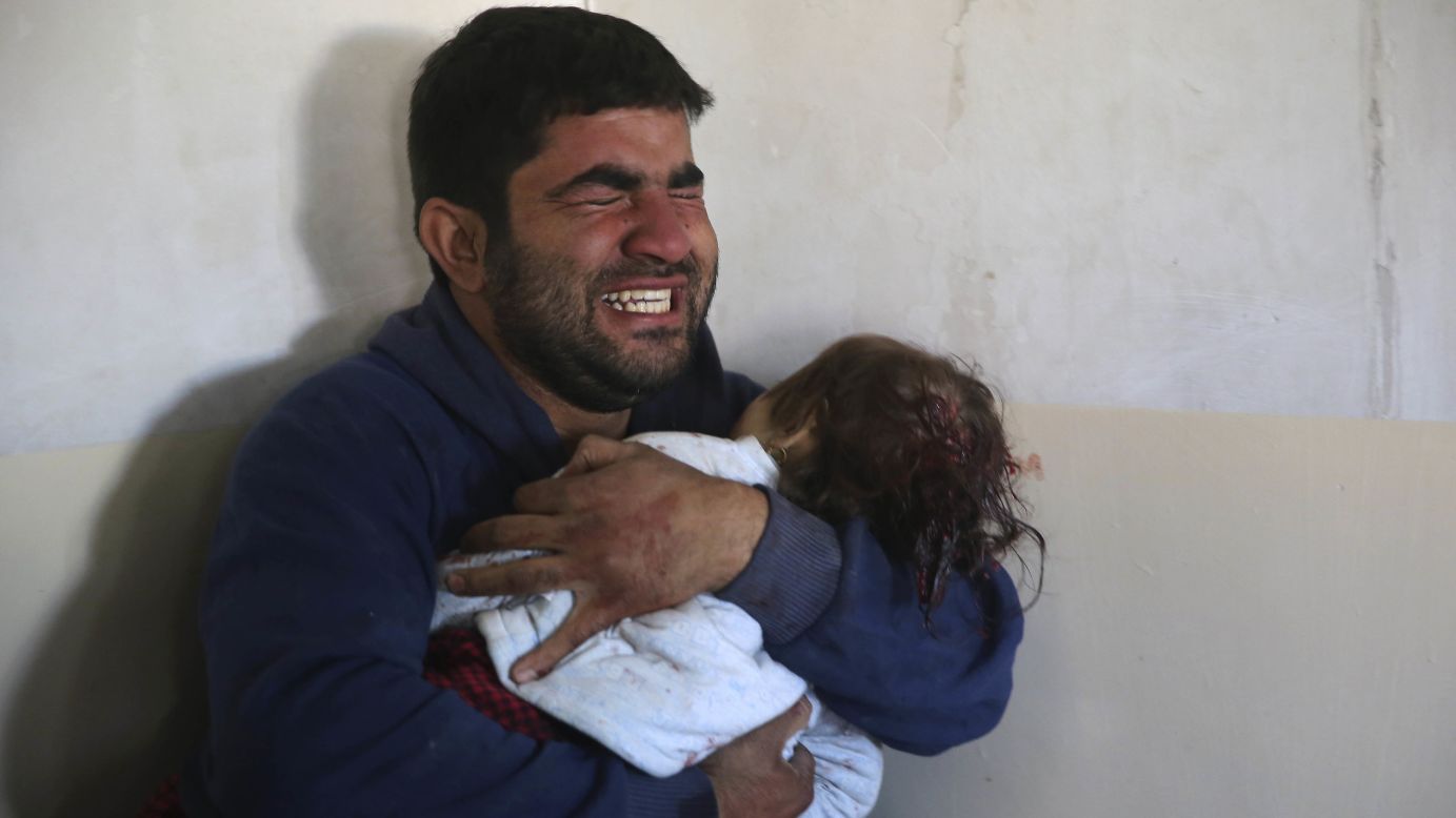 Omar Ali grieves as he holds his 15-month-old daughter, Amira, who was killed by an ISIS mortar in Mosul, Iraq, on Wednesday, November 23. An Iraqi-led coalition is fighting ISIS <a href="http://www.cnn.com/2016/10/17/world/gallery/mosul/index.html" target="_blank">to reclaim Mosul,</a> Iraq's second-largest city and the last major stronghold for ISIS in the country.