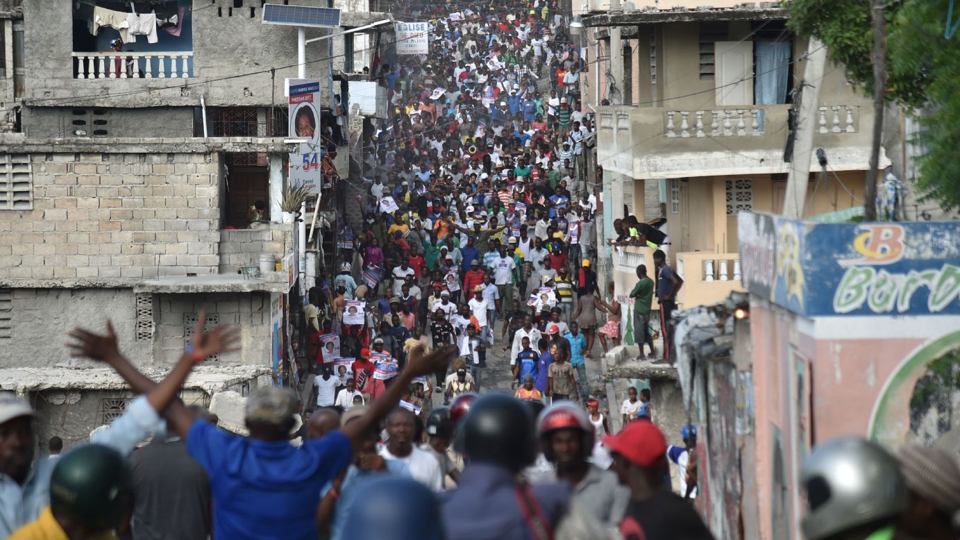 Supporters of Haitian presidential candidate Maryse Narcisse march in Port-au-Prince on Tuesday, November 22, two days after the election. At press time, votes were still being tabulated.