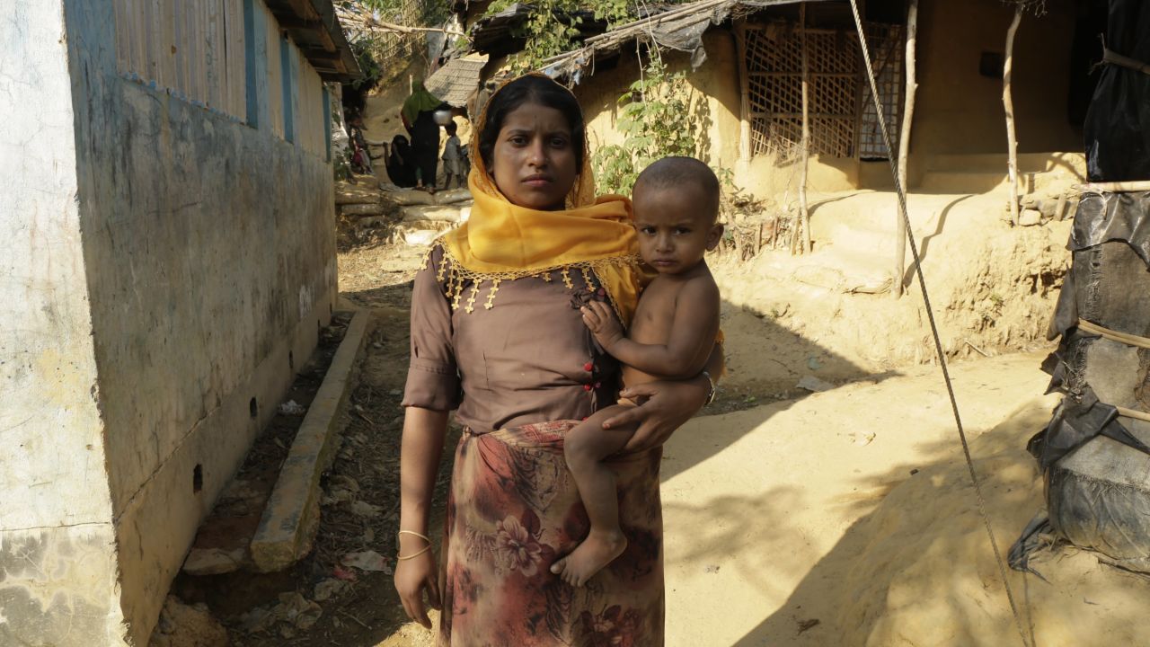 Rashida Khatun holds her baby inside the Kutupalong Rohingya camp in Bangladesh.