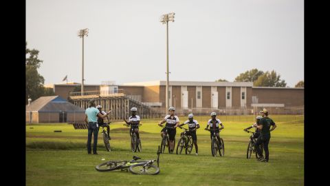 Dodson and his colleague Matt Kuhn lead cycling practice behind Armstrong High School in Richmond, Va. 
