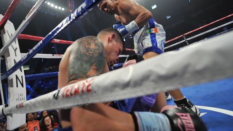 Cruz slumps against the ropes after a knockout punch from Salido.