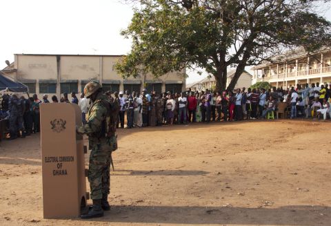 Just over half of Ghanaians believe political parties and/or candidates are likely to use violence in the upcoming elections. <br /><br />Pictured: A soldier casts his ballot at a polling station as other voters wait in line, in Accra, on December 7, 2012, during national elections. 
