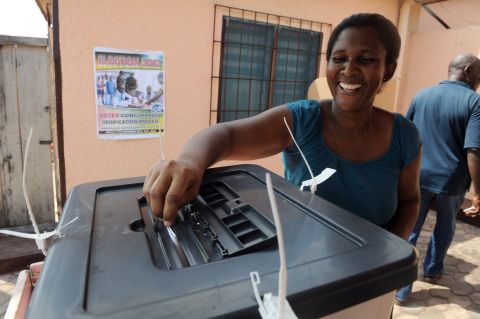 According to the electoral commission, Mahama won the 2012 election with 50.70 percent of the votes cast, compared to opposition candidate Nana Akufo-Addo's 47.74 percent. <br /><br />Pictured: A female voter casts her vote at Ayawaso West-Wagon Constituency polling station in Accra on December 8, 2012. 