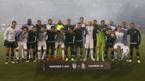 The US and Mexico men's national teams pose for a group photo before a 2018 FIFA World Cup qualifying match in Ohio on November 11, 2016.