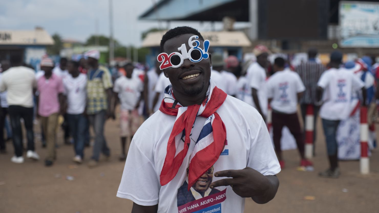A supporter of Ghana's largest opposition party New Patriotic Party (NPP) gestures at the party manifesto launch in Accra in October 2016.
